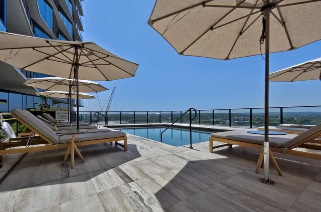 a view of a swimming pool with a patio