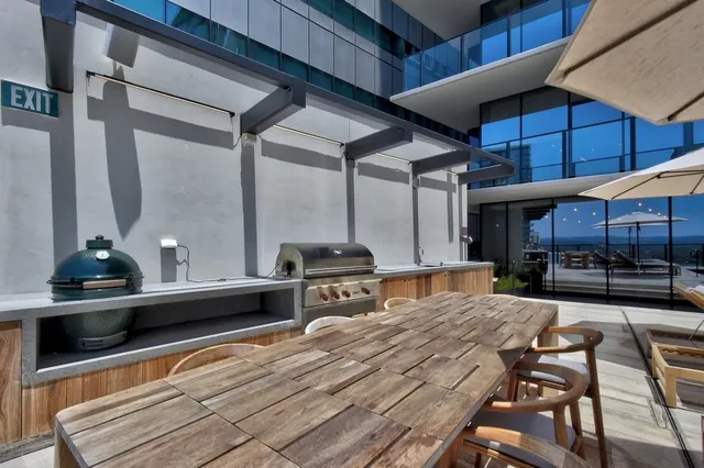 a kitchen with stainless steel appliances kitchen island granite countertop a sink and cabinets