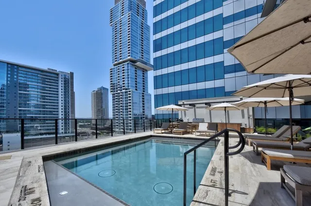 a kitchen with a table chairs and a barbeque