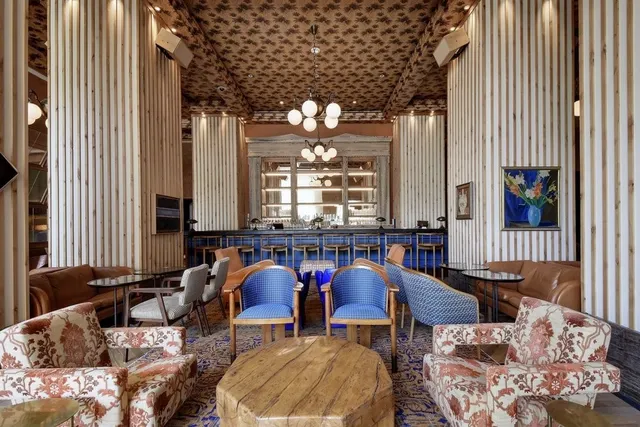 a dining room with furniture and window