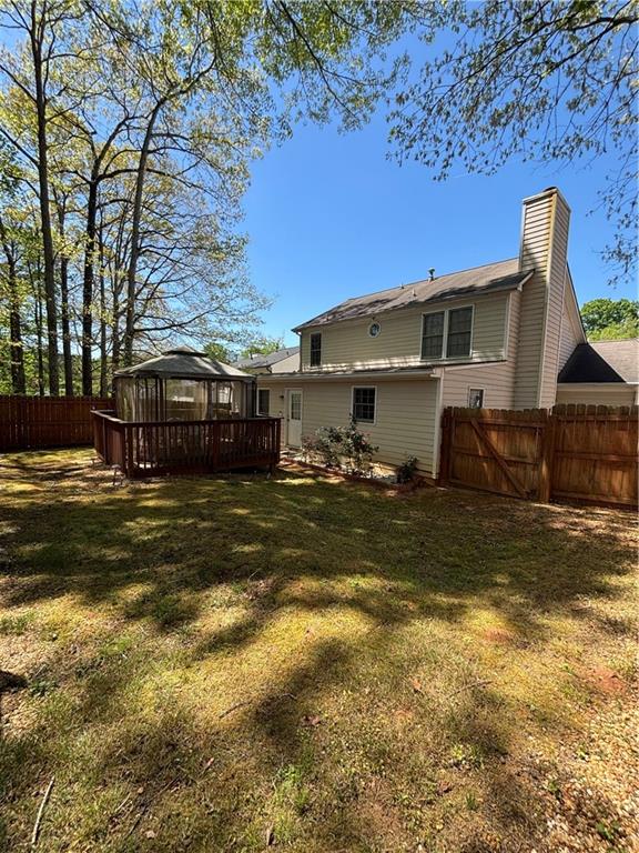 4949 Penscot Way Stone Mountain, GA 30088 - Photo 38 of 40 a front view of a house with a yard