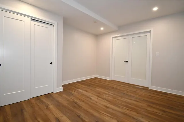 a view of room with wooden floor