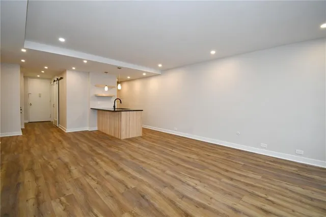a view of a kitchen with a sink
