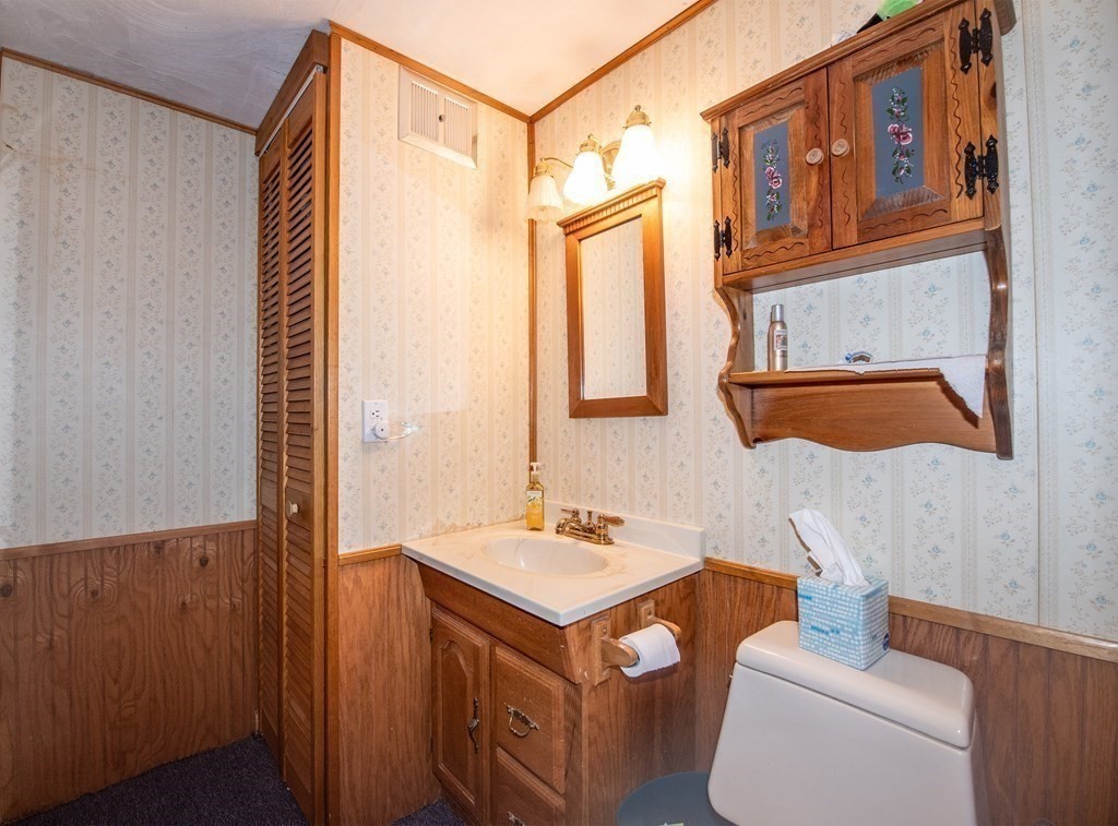 63 Kemp Street Groton, MA 01450 - Photo 14 of 24 a bathroom with a sink toilet and mirror