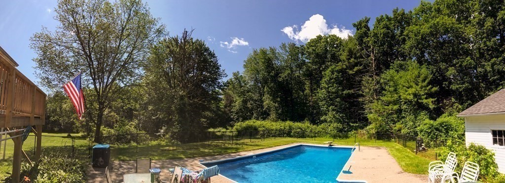 63 Kemp Street Groton, MA 01450 - Photo 17 of 24 a view of swimming pool with a yard