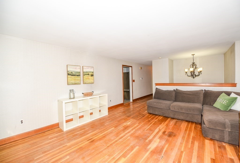 63 Kemp Street Groton, MA 01450 - Photo 5 of 24 a living room with furniture and painting on the wall