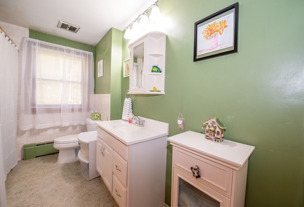63 Kemp Street Groton, MA 01450 - Photo 9 of 24 a bathroom with a sink and a toilet