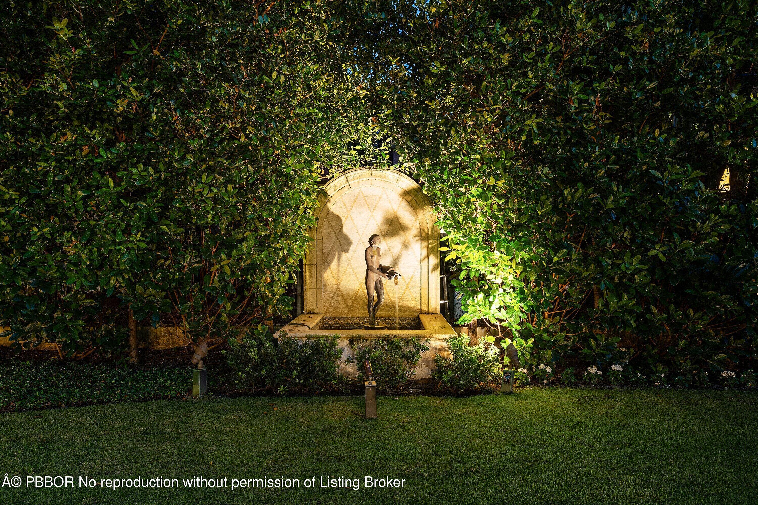 242 Wells Road Palm Beach, FL 33480 - Photo 54 of 54 a building view with a big garden and plants