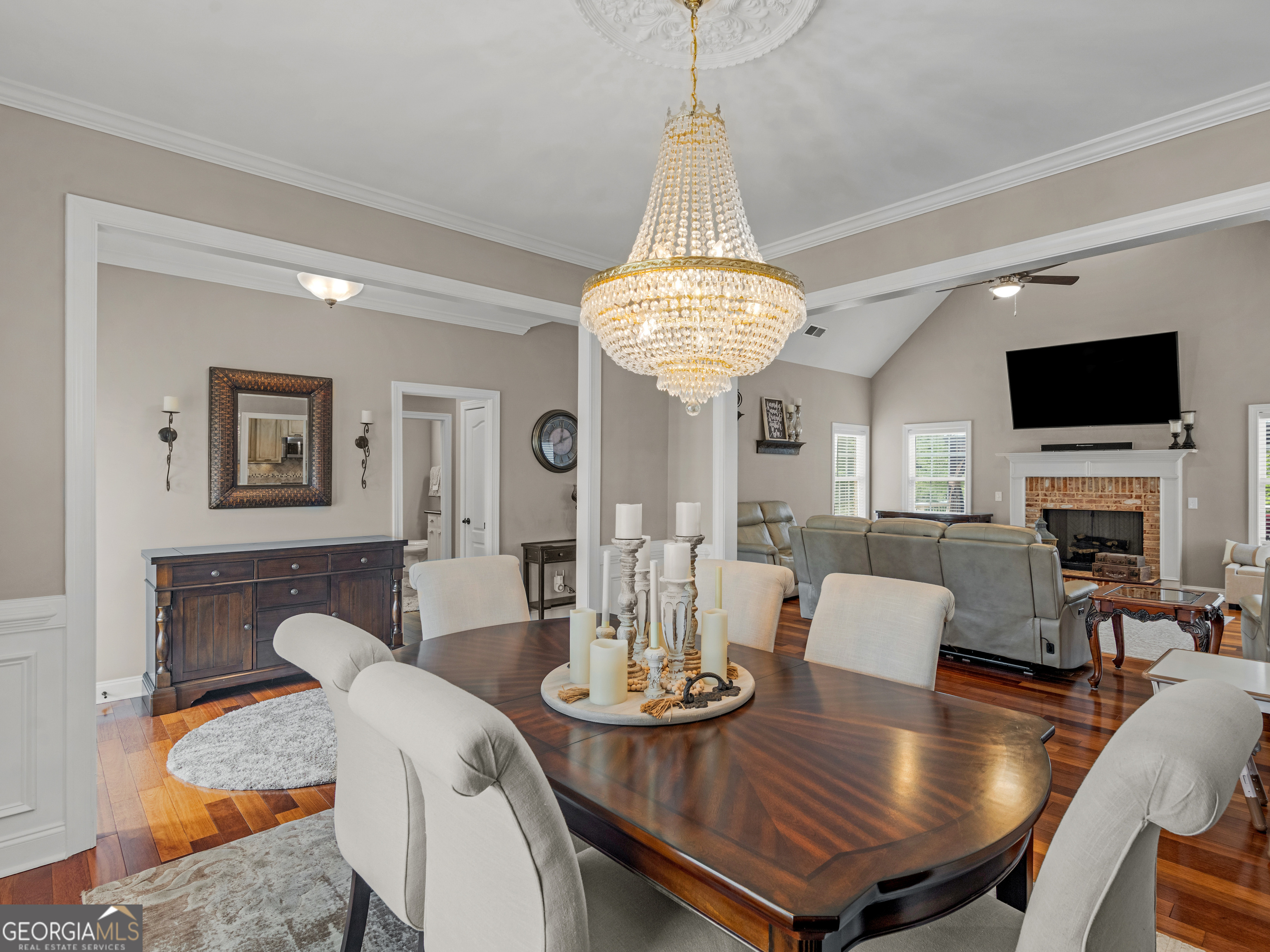 221 Hummingbird Court Hampton, GA 30228 - Photo 12 of 77 a view of a dining room with furniture a chandelier and wooden floor