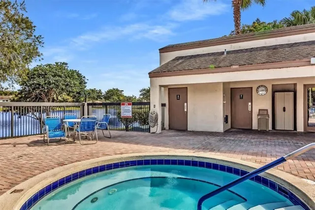 a swimming pool with outdoor seating yard and barbeque oven