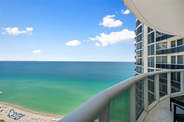 a view of a balcony with chairs