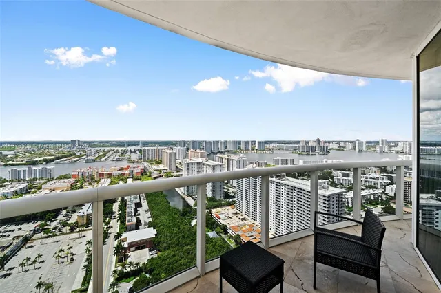 a kitchen with stainless steel appliances granite countertop a stove refrigerator and a microwave