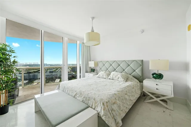 a bedroom with a bed and a cabinets