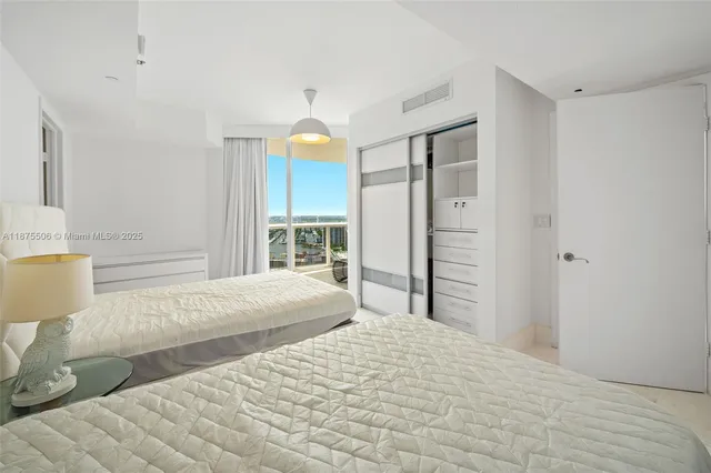 a view of a hallway with washer and dryer