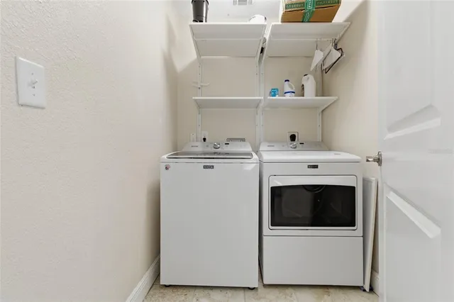a utility room with dryer and washer