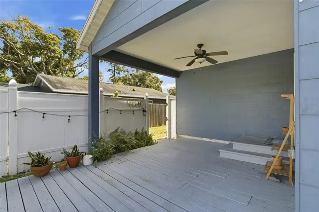 a view of a room with wooden floor and deck