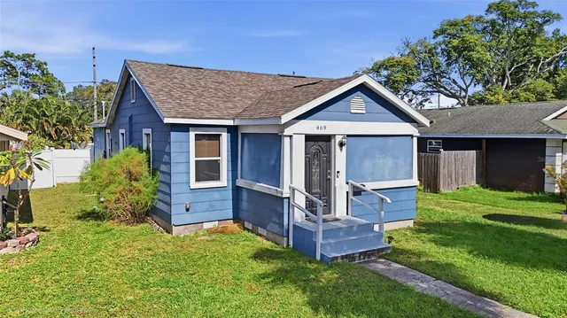 front view of a house with a yard