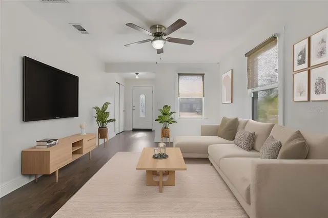 a living room with furniture and a flat screen tv
