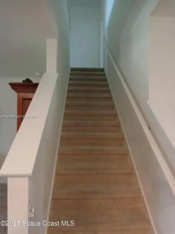 a bedroom with a bed and a table in it