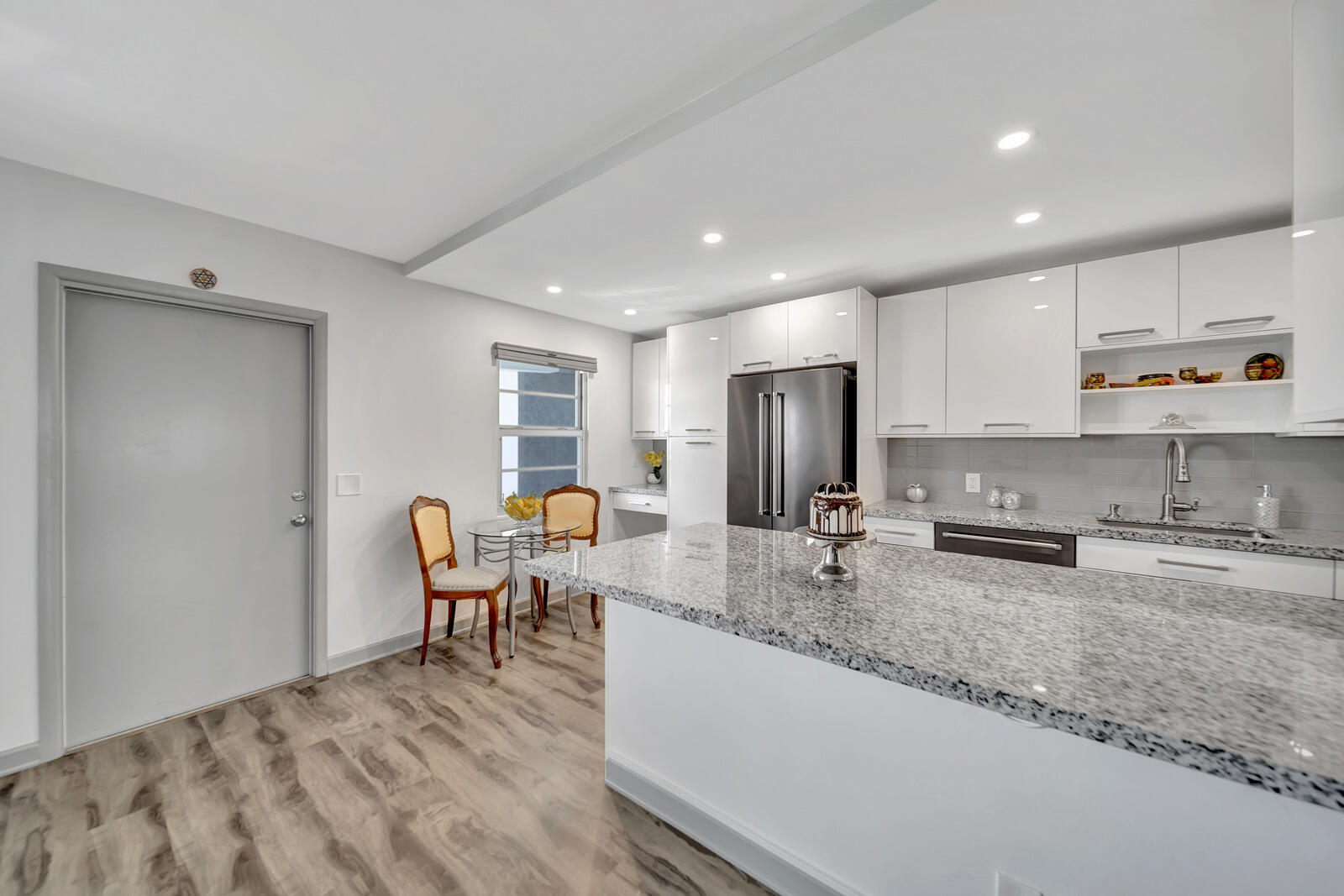 4063 Exeter Boca Raton, FL 33434 - Photo 16 of 55 a kitchen with stainless steel appliances granite countertop a sink and cabinets