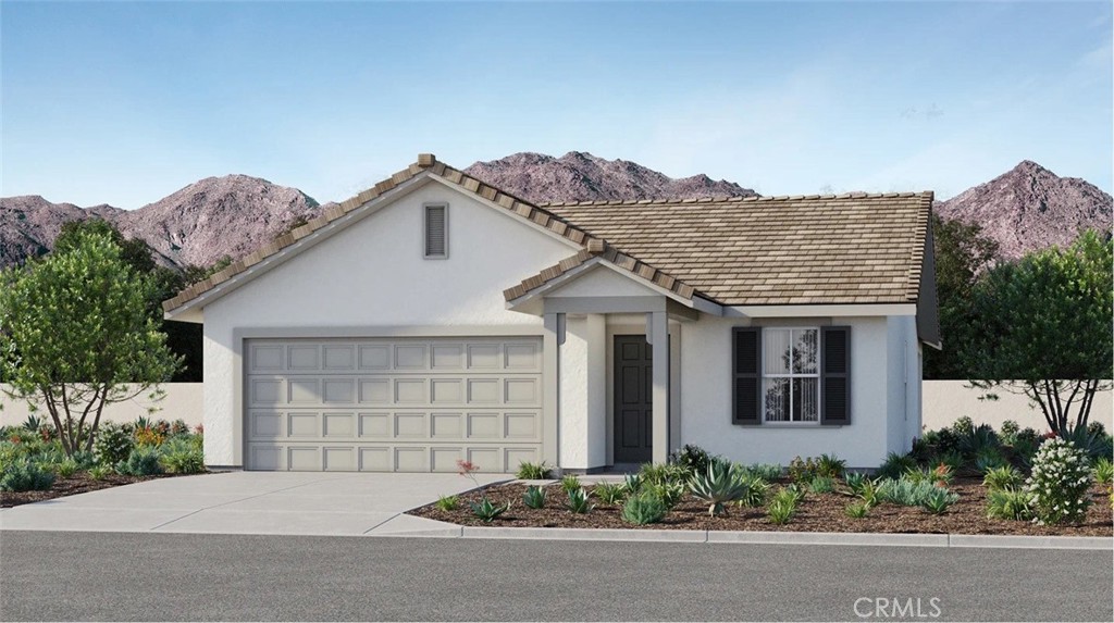 79327 Valor Lane Indio, CA 92203 - Photo 1 of 19 front view of a house with potted plants