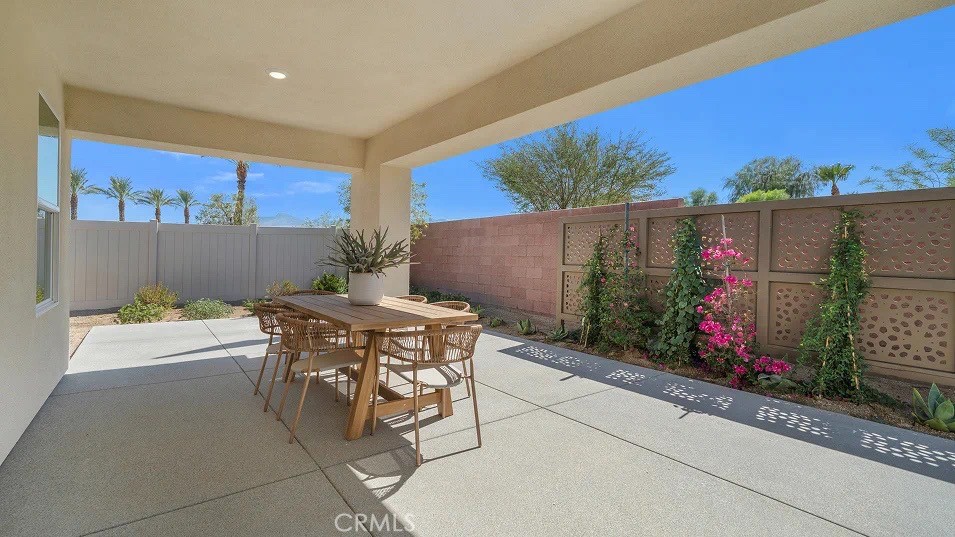 79327 Valor Lane Indio, CA 92203 - Photo 17 of 19 a outdoor dining space with furniture