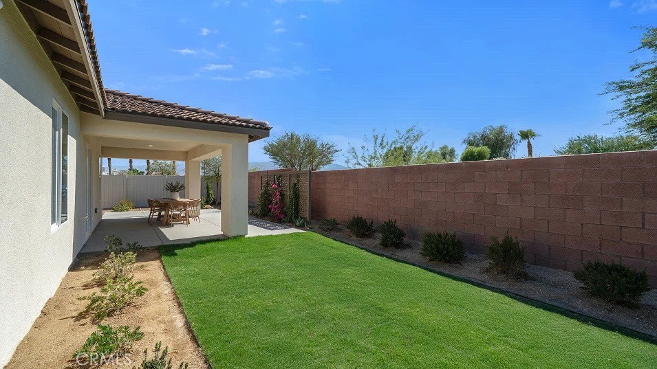 79327 Valor Lane Indio, CA 92203 - Photo 18 of 19 a view of a backyard with sitting area