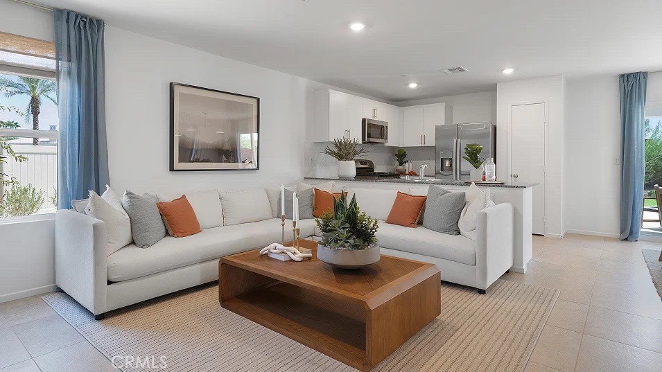 79327 Valor Lane Indio, CA 92203 - Photo 2 of 19 a living room with furniture and a large window