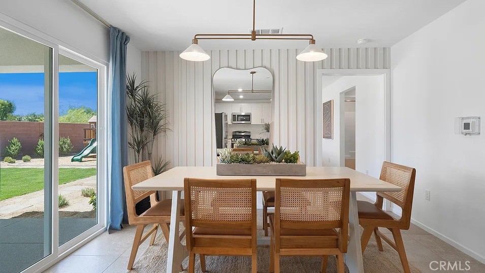 79327 Valor Lane Indio, CA 92203 - Photo 6 of 19 a dining room with furniture and window