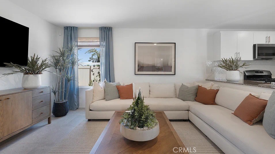 79327 Valor Lane Indio, CA 92203 - Photo 7 of 19 a living room with furniture and a flat screen tv