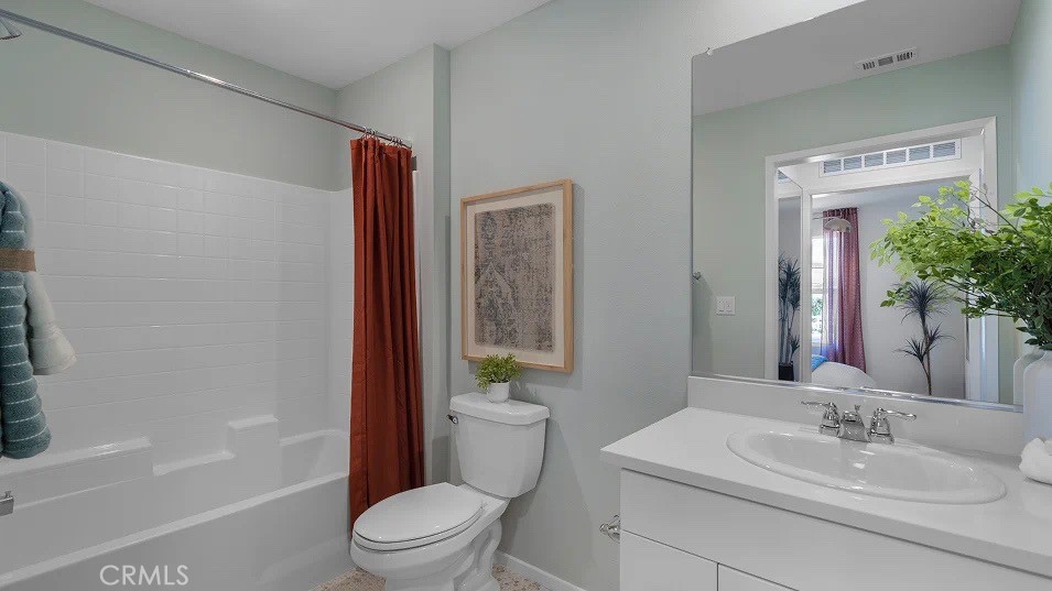 79327 Valor Lane Indio, CA 92203 - Photo 9 of 19 a bathroom with a sink a toilet and shower