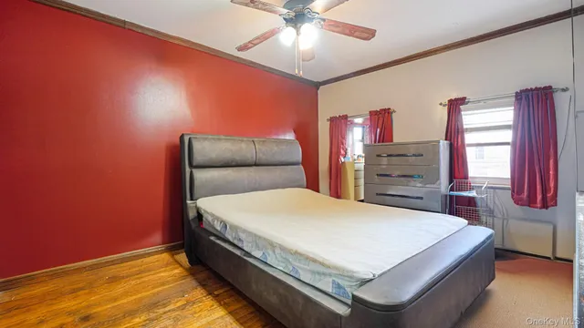 a bedroom with a bed and a table in it