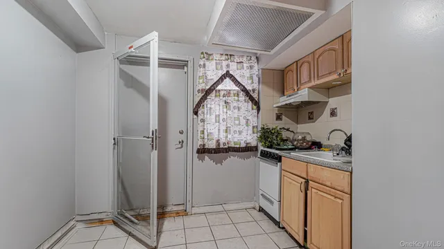 a white toilet sitting next to a bathroom sink