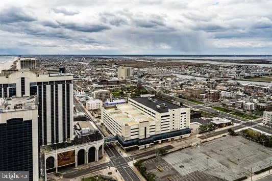 a kitchen with stainless steel appliances kitchen island granite countertop a refrigerator and a stove top oven