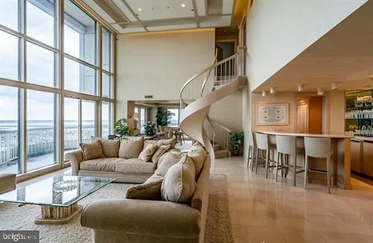a dining room with furniture and entryway