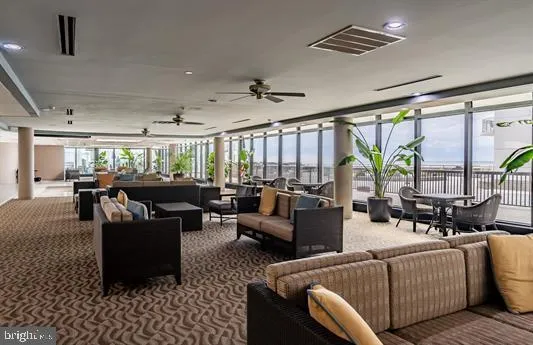 a living room with furniture and flat screen tv