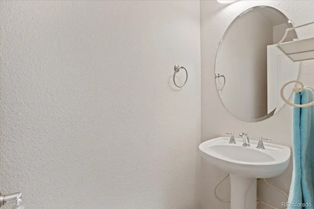a bathroom with a sink and mirror