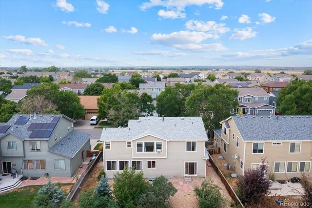 an aerial view of residential houses with outdoor space