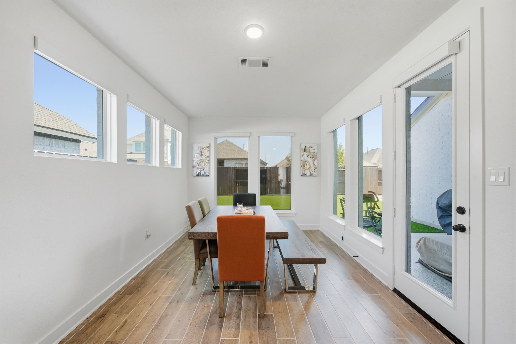 10438 Rigel Rdg Way Richmond, TX 77406 - Photo 15 of 34 a view of a dining room with furniture and wooden floor