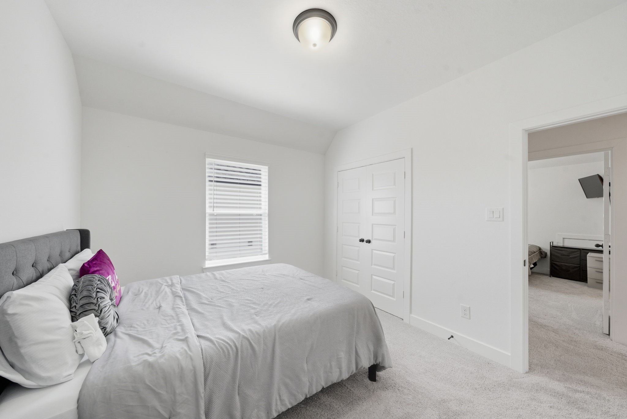 10438 Rigel Rdg Way Richmond, TX 77406 - Photo 21 of 34 a bedroom with a bed and a couch