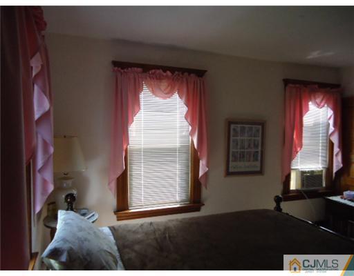 242 Rector Street Perth Amboy, NJ 08861 - Photo 12 of 18 a view of an empty room and window