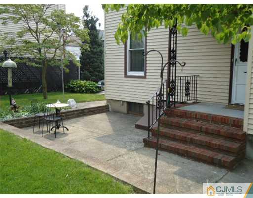 242 Rector Street Perth Amboy, NJ 08861 - Photo 15 of 18 a view of a bench in a backyard