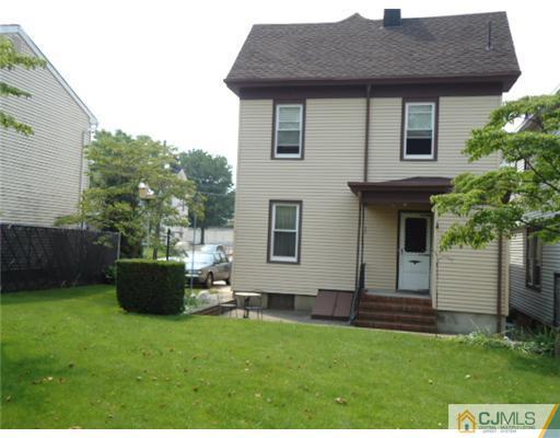 242 Rector Street Perth Amboy, NJ 08861 - Photo 16 of 18 a view of a house with backyard