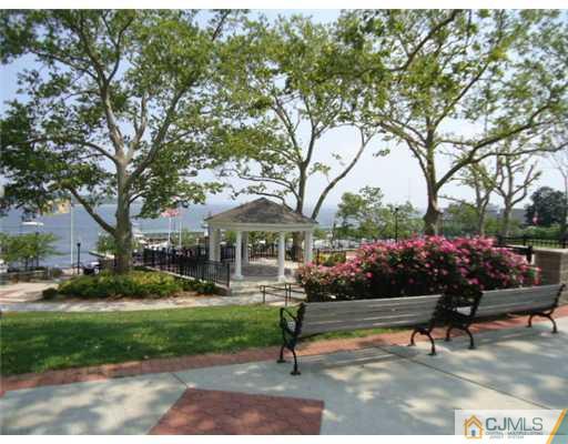 242 Rector Street Perth Amboy, NJ 08861 - Photo 18 of 18 a view of a house with a garden and pathway