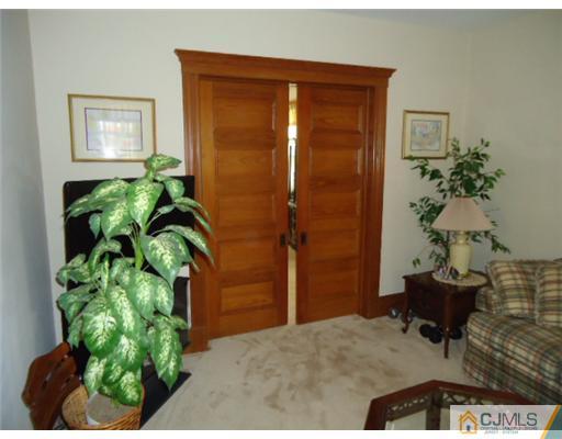 242 Rector Street Perth Amboy, NJ 08861 - Photo 4 of 18 a potted plant sitting in front of a bathroom