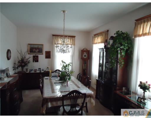 242 Rector Street Perth Amboy, NJ 08861 - Photo 5 of 18 a view of a livingroom and dining room
