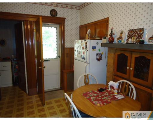 242 Rector Street Perth Amboy, NJ 08861 - Photo 8 of 18 a bedroom with a bed and a television