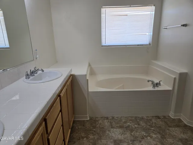 a bathroom with a sink and a bathtub