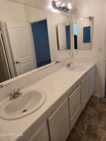 a view of a hallway with closet and wooden floor