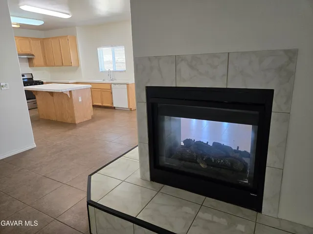 a kitchen with stainless steel appliances a stove a microwave and sink